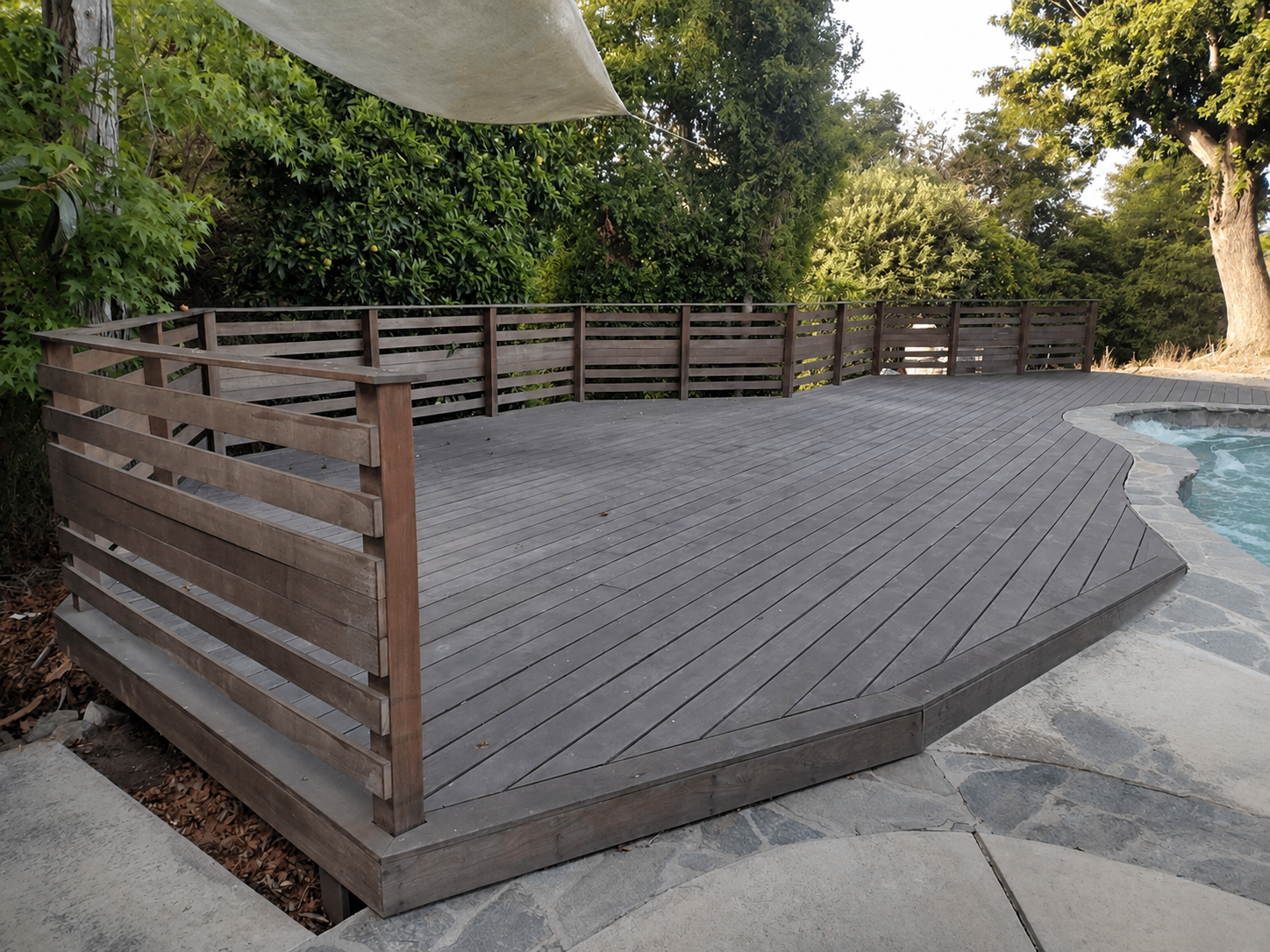 Weathered exterior wood deck before refinishing