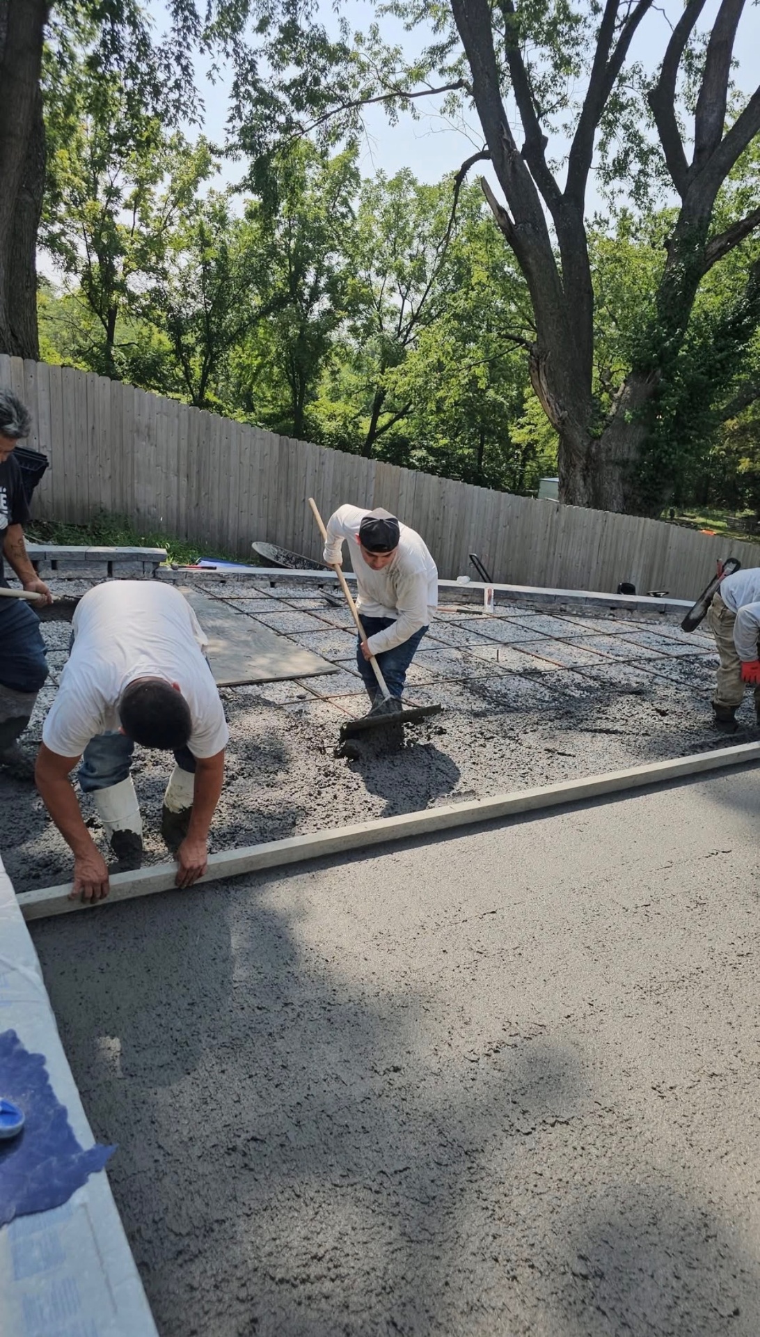E&B 3 Brothers Concrete crew pouring and finishing a large concrete pad